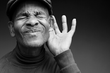 deafness suffering from hearing loss on grey black background with people stock image stock photo	