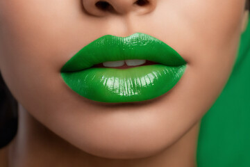 Close-up of beautiful lips with light green lipstick
