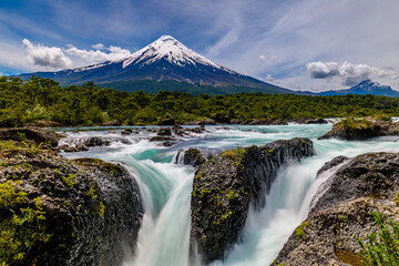 Petrohué Waterfalls with snow-capped Osorno Volcano seen in the background, Vicente Pérez Rosales National Park, Lake District, Chile