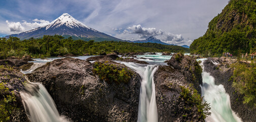 Petrohué Waterfalls with snow-capped Osorno Volcano seen in the background, Vicente Pérez Rosales...