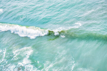 Wave splashing close-up. Crystal clear sea water, in the ocean in San Francisco Bay, blue water, pastel colors.