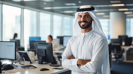 Happy Emirati Arab at office wearing Kandura