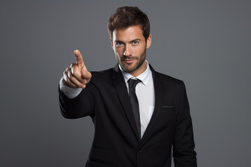 young smiling man in formal wear pointing with finger on you