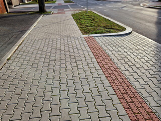 navigation tactile tiles strip for blind and disabled pedestrians who have vision problems. The red...
