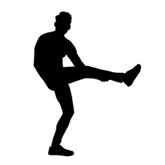 Silhouette of a male dancer in action pose. Silhouette of a slim man in dancing pose.