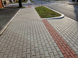 navigation tactile tiles strip for blind and disabled pedestrians who have vision problems. The red...
