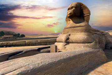 Foto op Canvas Egyptian Great Sphinx full body portrait with head, feet with all pyramids of Menkaure, Khafre, Khufu in background on a clear, blue sky day in Giza, Egypt empty with nobody. copy space  © khan