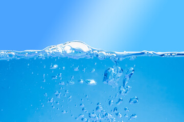 Blue water with air bubbles on a blue background. Close-up