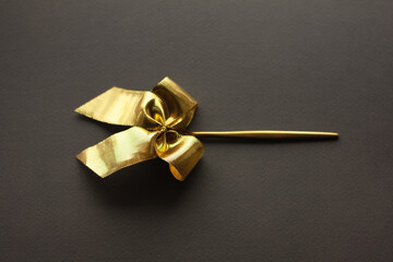 golden bow in a golden spoon