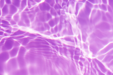 Purple water splashes on the surface ripple blur. Defocus blurred transparent pink colored clear calm water surface texture with splash and bubble. Water waves with shining pattern texture background.