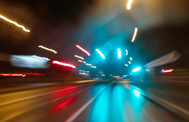 City colorful night lights perspective blurred by high speed of the car. A streak of light, trails. - obrazy, fototapety, plakaty