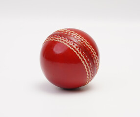 A Shiny New Test Match Cricket Ball Leather Hard Circle Stitch Closeup Picture On White Background