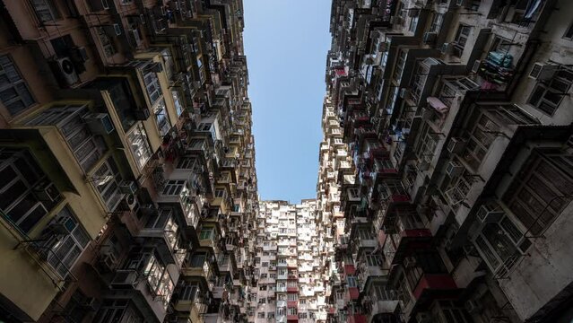 Time lapse of Hong Kong apartment monster building. Timelapse Yick Fat Building Hong Kong. Footage B roll