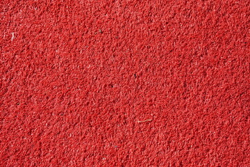 Red synthetic carpet. Red felt background. Surface of fabric texture cloth background for Christmas...