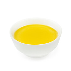 Yellow sauce, on a wooden board, on a white background