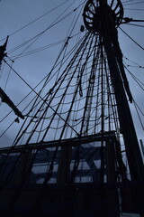 vintage ship with a mast on the pier