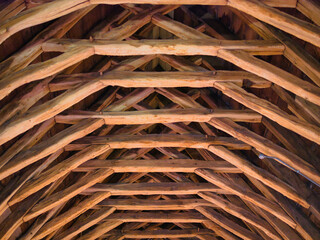 Scissor-braced trusses in the medieval roof of the Masons' Loft on the first floor of the L-shaped...
