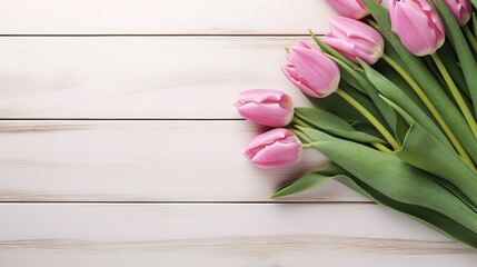 Bouquet of tulips on wooden background. Top view with copy space	
