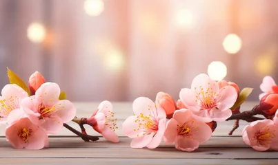 Tuinposter Blossoming branch of peach on a wooden background with copy space © TheoTheWizard
