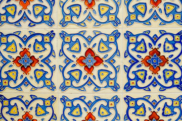 Art deco tiles with floral pattern abstract design on the wall.