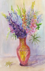 Bouquet of lupins in a red glass vase - 697232544