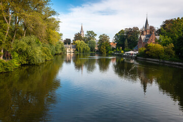 Fototapeta na wymiar Bruges, Belgium, beautiful foreshortening of Minnewater Park (Lake of Love Park).