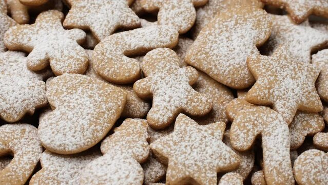 Christmas cookies with sugar powder. Gingerbread cookies close up, rotation