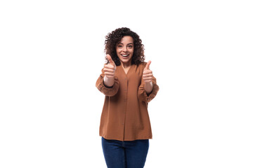 young cheerful pleasant slender woman with curls dressed in a brown shirt