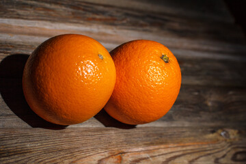 Round orange on a wooden background, orange for juice, citruses
