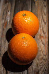 Round orange on a wooden background, orange for juice, citruses
