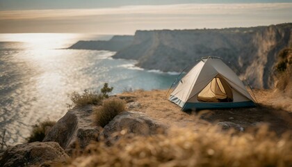Amazing spot for a camp night: Tent near cliff at the sea. Adventure and travel explorer concept