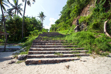 Steps leading down to Virgin beach or White Sand beach in Bali, Indonesia