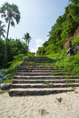 Steps leading down to Virgin beach or White Sand beach in Bali, Indonesia