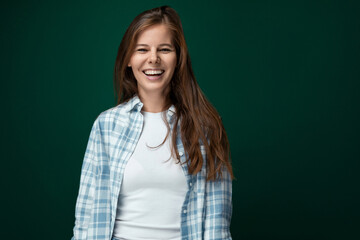 Fototapeta premium Portrait of an attractive young lady with gorgeous long brown hair