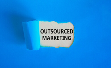 Outsourced marketing symbol. Concept words Outsourced marketing on beautiful white paper. Beautiful...