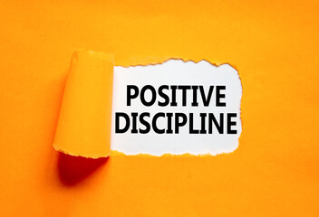 Positive discipline symbol. Concept words Positive discipline on beautiful white paper. Beautiful orange paper background. Business psychology positive discipline concept. Copy space.