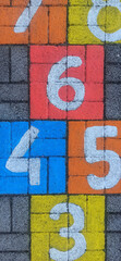 Math number colorful on pavement background, education study mathematics learning teach concept - 697264912