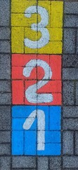 Math number colorful on pavement background, education study mathematics learning teach concept - 697264937