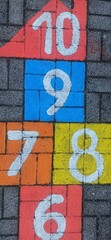 Math number colorful on pavement background, education study mathematics learning teach concept - 697264938