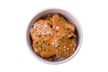 Delicious sweet round sponge cookies sprinkled with coconut flakes