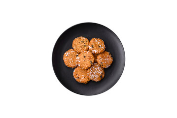 Delicious sweet round sponge cookies sprinkled with coconut flakes