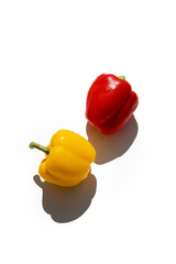 Yellow and red fresh peppers on a white background. Top view, flat lay