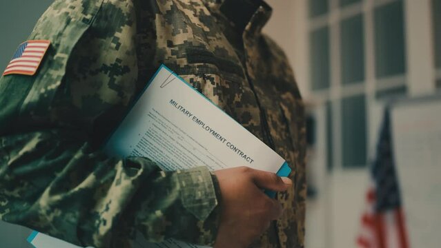 U.S. soldier holding military employment contract, military professions for hire