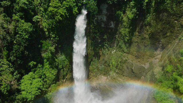 Waterfalls over the rainbow with beautiful water splashing and making mist. Lake Sebu, South Cotabato. Mindanao, Philippines.