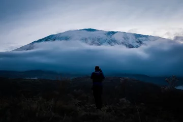 Papier Peint photo autocollant Kilimandjaro Man capturing Kilimanjaro at dawn