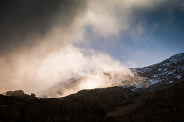 Clouds in the morning sunlight on the slopes of Kilimanjaro