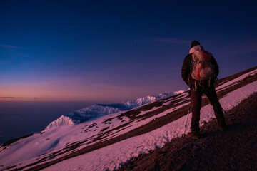 Hiker near the Kilimanjaro summit at dawn