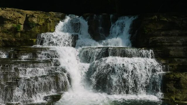 Slow motion of a multi-tiered waterfall in Bislig. Tinuy-an Falls. Surigao del Sur. Philippines.