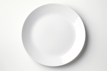 A white plate on a white surface.