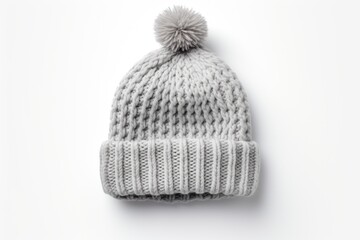 A cozy knitted hat with a playful pom pom on top. Perfect for staying warm and stylish during the colder months. Great for winter fashion or outdoor activities